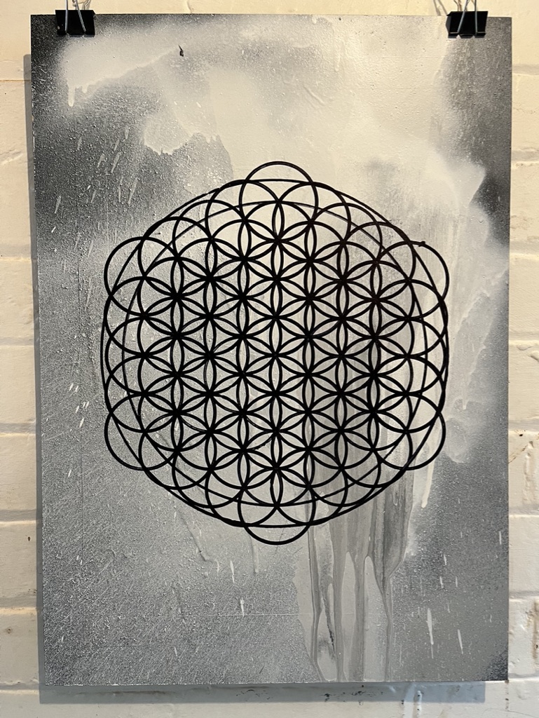 a2 flower of life pattern with burst spray paint can background